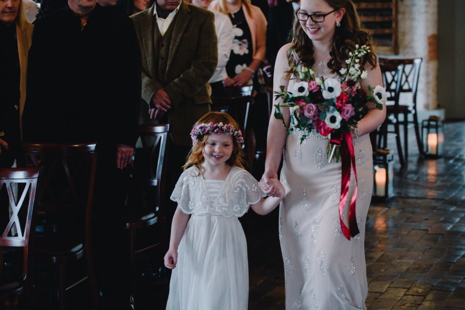 young flower girl and bridesmaid