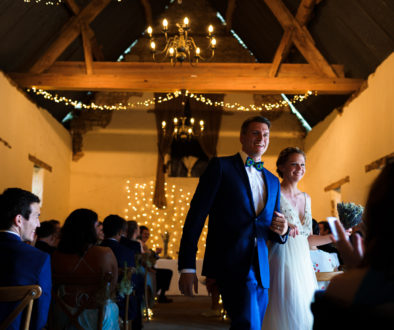 Bride and Groom leave their wedding ceremony at Slapton Manor