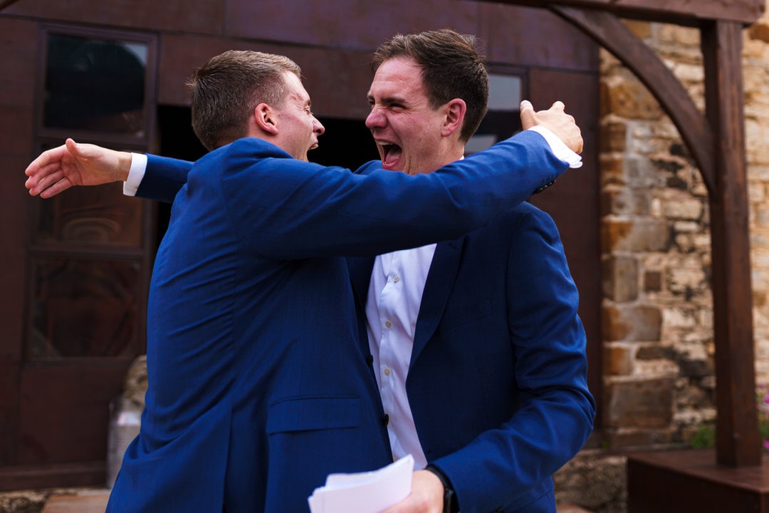 brothers embrace at slip-on manor
