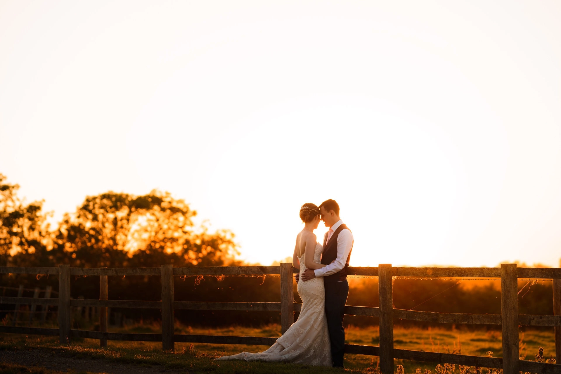 Bride and Groom at golden hour outside of Wood Farm wedding venue in Everdon